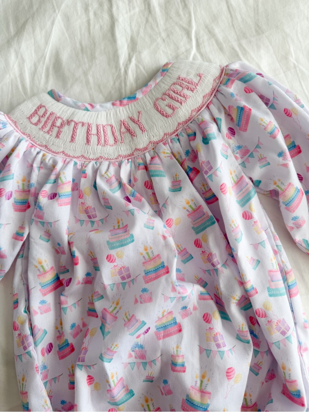 The Smocked Flamingo Baby “Birthday Girl” Onesie